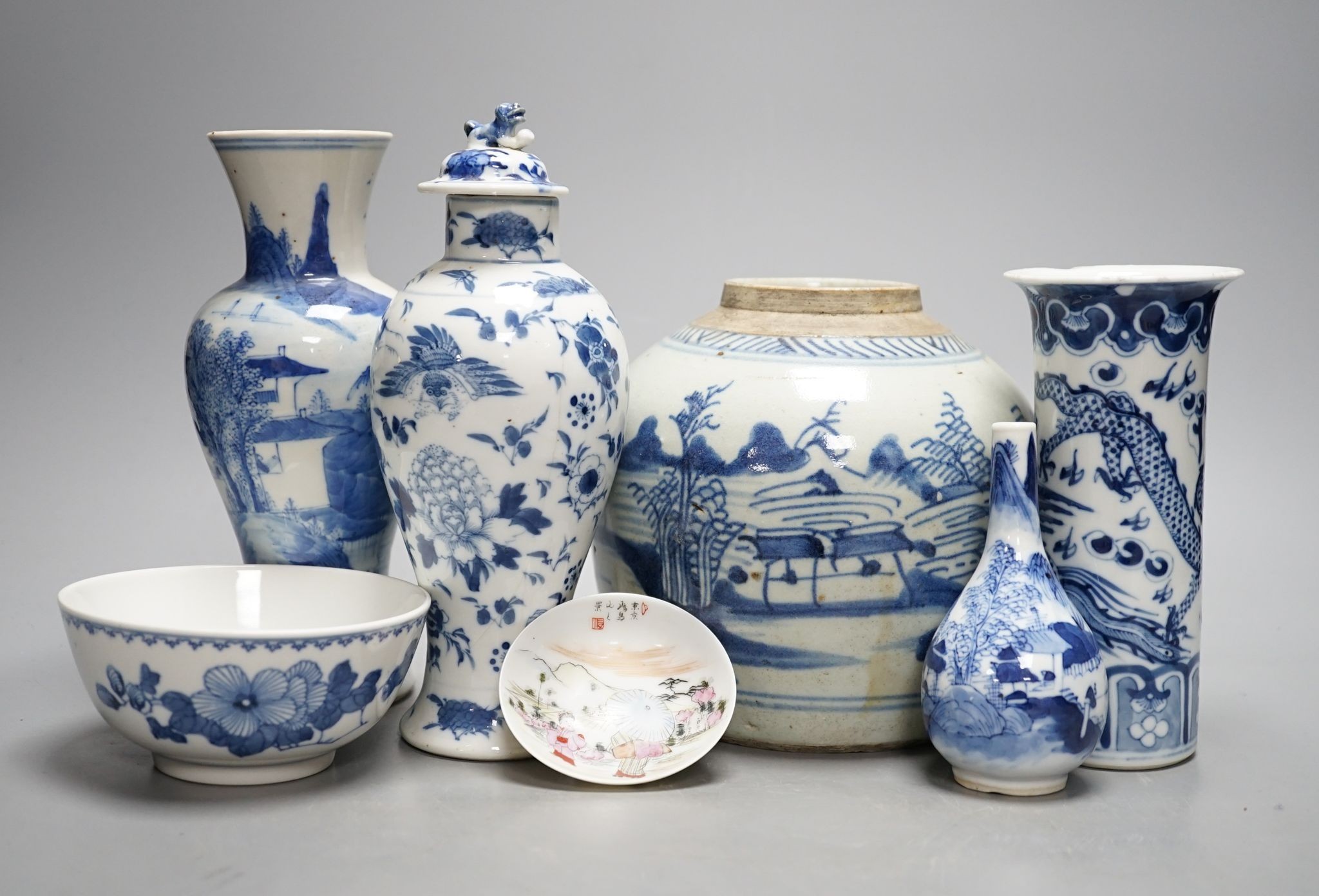 Twelve pieces of 19th century Chinese blue and white tableware and a small famille rose bowl, largest 20cm